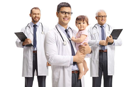 Three male doctors pediatricians with a baby isolated on white backgroundの写真素材