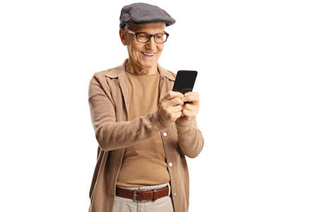 Happy elderly gentleman standing and using a smartphone isolated on white background