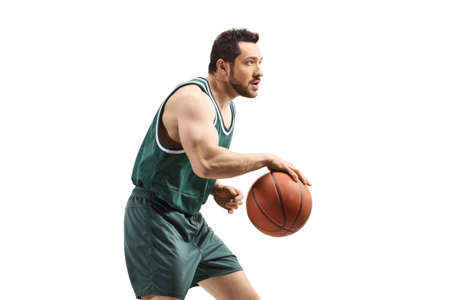 Basketball player running with a ball isolated on white background