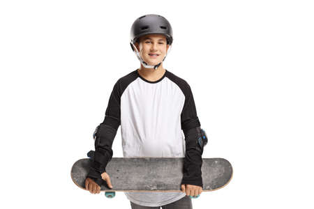 Teenage boy with skateboard, helmet and elbow safety pads isolated on white background