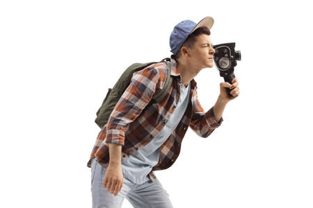 Student with a backpack recording with a vintage 8 mm camera isolated on white backgroundの写真素材