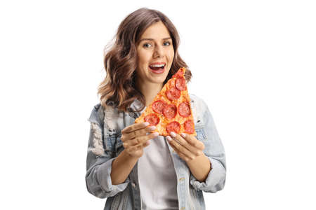 Happy young woman eating a slice of pizza isolated on white background