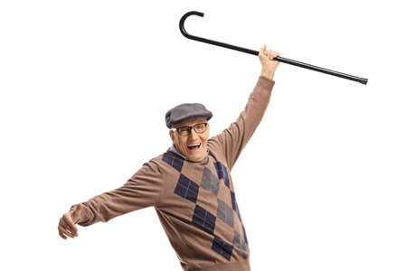 Happy elderly man dancing with his walking cane up isolated on white backgroundの写真素材