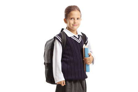 Pupil in a uniform holding books isolated on white background