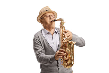 Senior male musisican playing a saxophone isolated on white backgroundの写真素材