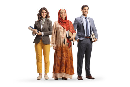 Teachers from different ethnicity holding books and posing isolated on white backgroundの写真素材