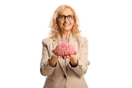 Woman holding a human brain in her hands and smiling isolated on white background