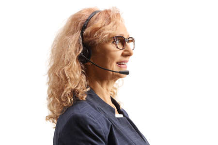 Profile shot of a female dispatcher with a headset and microphone isolated on white backgroundの写真素材
