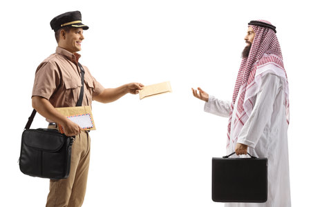 Mailman delivering a letter to a saudi arab man in ethnic clothes isolated on white backgroundの写真素材