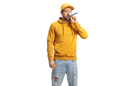 Guy blowing a party horn isolated on white background