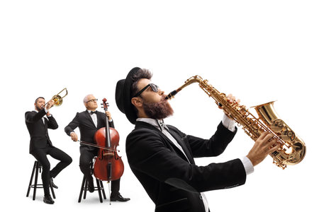 Man playing a sax and other artists playing a trombone and a cello isolated on white backgroundの写真素材