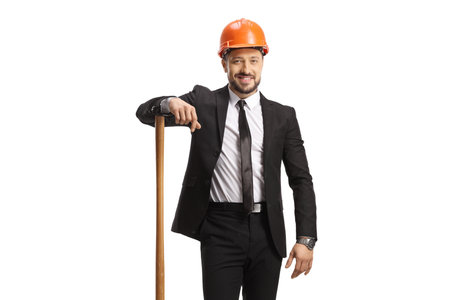 Businessman with a helmet standing with a wooden stick isolated on white backgroundの写真素材
