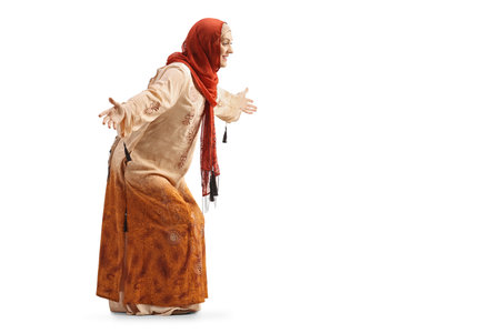 Muslim woman in ethnic clothes waiting with arms wide open isolated on white backgroundの写真素材