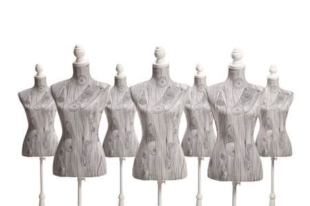 Studio shot of many tailor torso mannequins isolated on white backgroundの写真素材