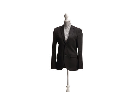 Mannequin doll with a black suit isolated on white backgroundの写真素材