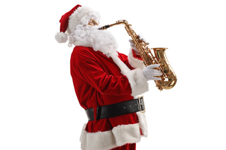 Profile shot of Santa claus playing a saxophone isolated on white backgroundの写真素材