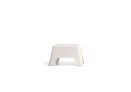 Studio shot of a small white plastic chair isolated on white background