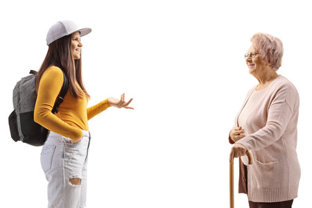 Conversation between a female student and an elderly woman isolated on white backgroundの写真素材