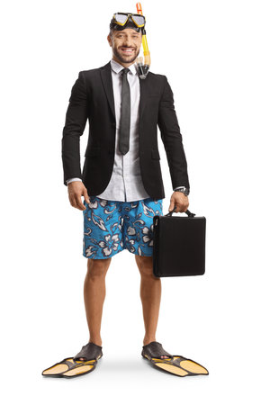 Businessman in a swimsuit with snorkelling fins and mask holding a briefcase isolated on white backgroundの写真素材