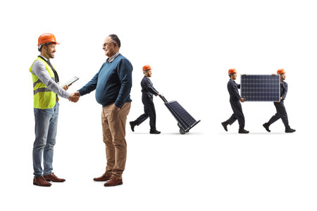 Engineer greeting a customer and workers carrying solar panels isolated on white backgroundの写真素材