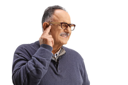 Mature man with ear pain isolated on white background
