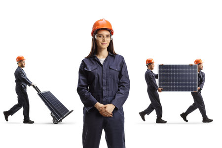 Female factory worker posing in the front and men carrying photovoltaics isolated on blue background