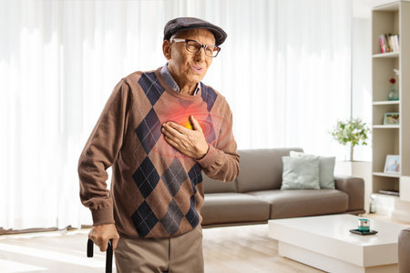 Elderly man holding his chest, red inflammation zone, pain and desease concept