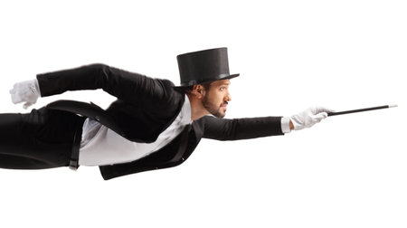 Magician levitating and holding a magic wand isolated on white backgroundの写真素材