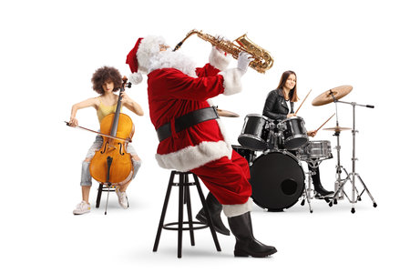 Santa claus playing a saxophone with female musicians on  drums and cello isolated on white backgroundの写真素材