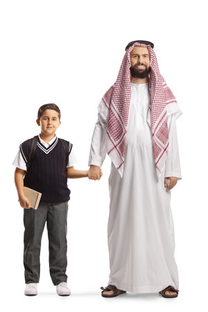Full length portrait of a saudi arab father holding his son by the hand isolated on white backgroundの写真素材