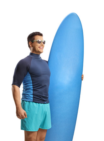 Man with sunglasses holding a surfing board and smiling isolated on white backgroundの写真素材