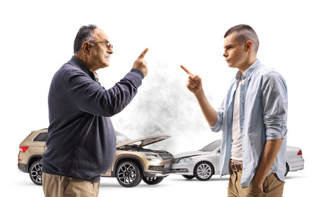 Young man and a mature man having an argument about a car accident isolated on white background