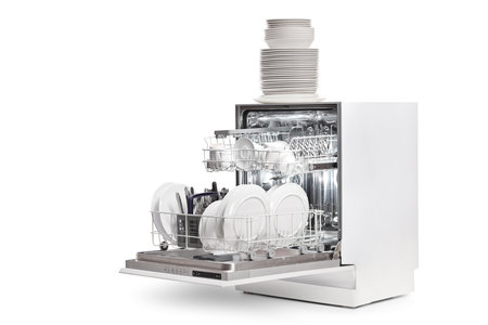 Dishwasher with a pile of plates isolated on white backgroundの写真素材