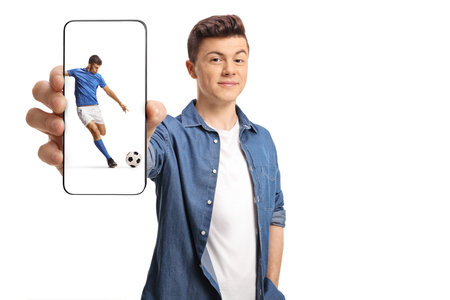 Young man showing a smartphone with football player on the screen isolated on white background