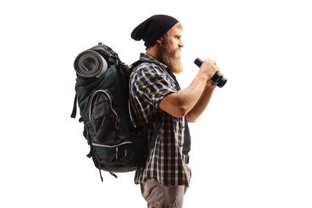 Bearded man with a backpack holding binoculars isolated on white background