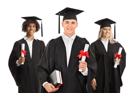 Group of graduate students in gowns isolated on white backgroundの写真素材