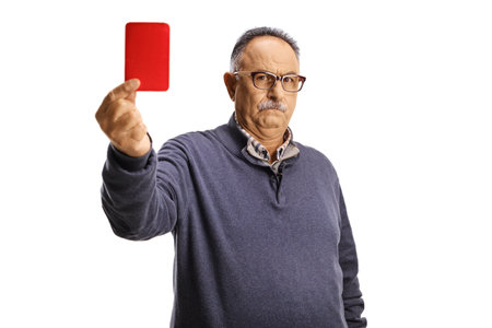 Serious mature man showing a red card isolated on white background