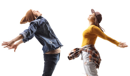 Profile shot of a young man and woman jumping isolated on white backgroundの写真素材