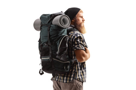 Man with a backpack and hiking equipment isolated on white background