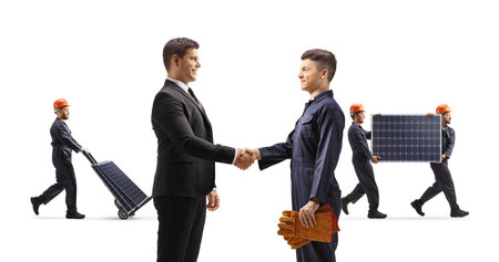 Man shaking hand with a worker, solar panel production concept isolated on white backgroundの写真素材