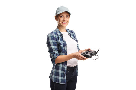 Young female farmer flying a drone, smart farming and advanced technology concept isolated on white...