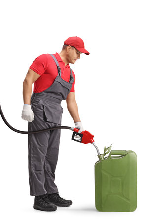Gas station worker filling a jerrycan with petrol isolated on white backgroundの写真素材