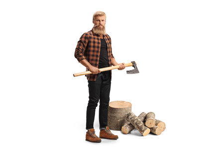 Man holding a hatchet and cutting wood isolated on white backgroundの写真素材
