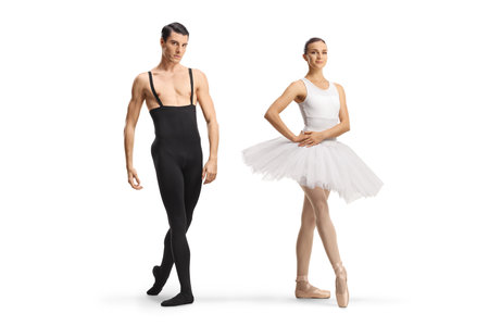 Full length portrait of a male and female ballet dancers posing isolated on white backgroundの写真素材