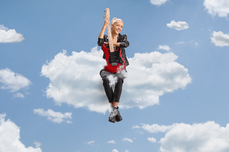 Woman with a guitar sitting on a cloud up in the sky