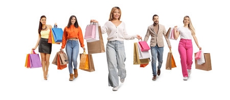 Group of people walking towards camera with shopping bags isolated on white backgroundの写真素材