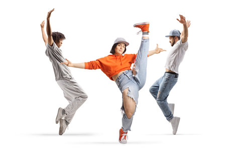 Men and a woman dancing and lifting legs up isolated on white backgroundの写真素材