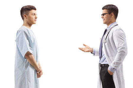 Male doctor talking to a young male patient isolated on white backgroundの写真素材