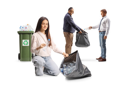 Men and a teenage girl collecting plastic bottles for recycling isolated on white backgroundの写真素材