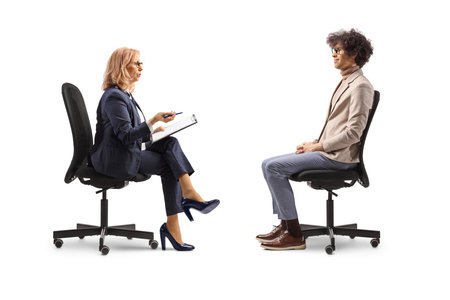 Man and woman sitting in office chairs, job interview concept isolated on white backgroundの写真素材